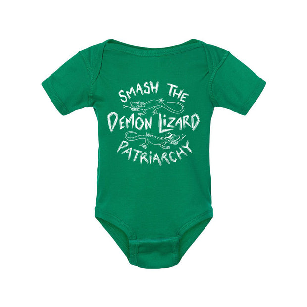A Kelly Green baby onesie by Buffering the Vampire Slayer with white text saying “Smash the Demon Lizard Patriarchy” and simple lizard illustrations around the words.