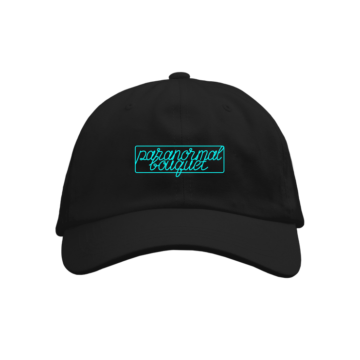 A black baseball cap from Buffering the Vampire Slayer featuring neon blue cursive "paranormal bouquet" in a rectangular outline, shown on a plain white background.