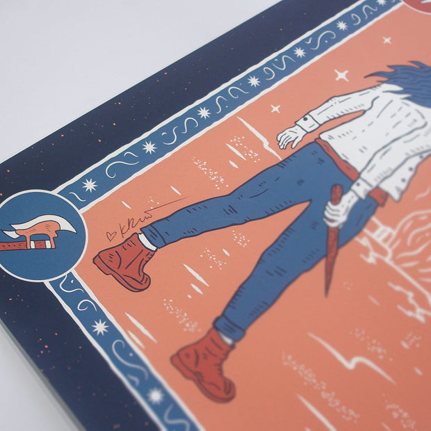 A close-up of an illustrated Buffering The Vampire Slayer print shows a person in jeans and red boots holding a tool. The navy border features a hammer icon, wavy patterns, star-like dots, and Devan Power’s signature.