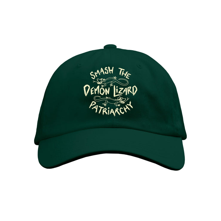 This Buffering the Vampire Slayer Limited Edition dark green Dad Hat features Smash the Demon Lizard Patriarchy in cream text, with charming illustrations of two lizards.