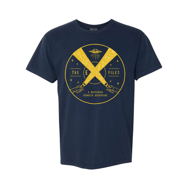 image of a navy tee shirt on a white background. tee has center chest print in yellow of a circle. inside the circle is a U F O at the top and two hands holding flashlights at the bottom. the beams cross to form an X for the EX files