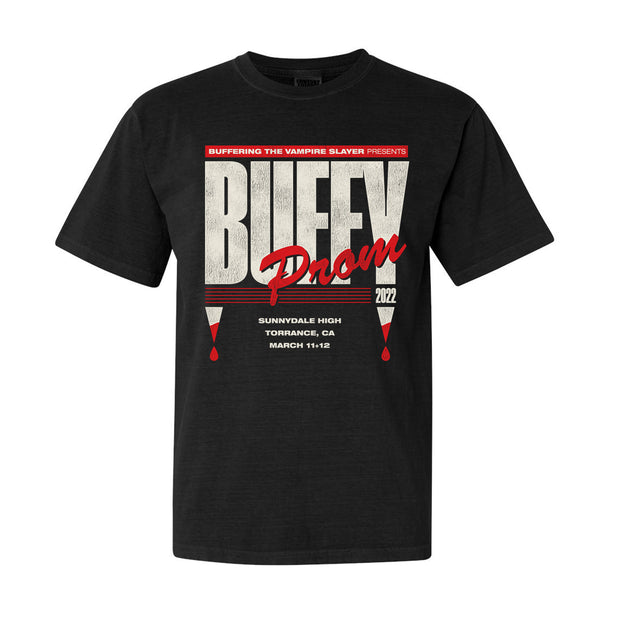 Black Comfort Colors T-Shirt by Buffering the Vampire Slayer featuring bold “BUFFY Prom 2022” text, Sunnydale High prom details, blood drop graphics, event dates March 11–12, and crafted from soft, garment-dyed heavyweight fabric.